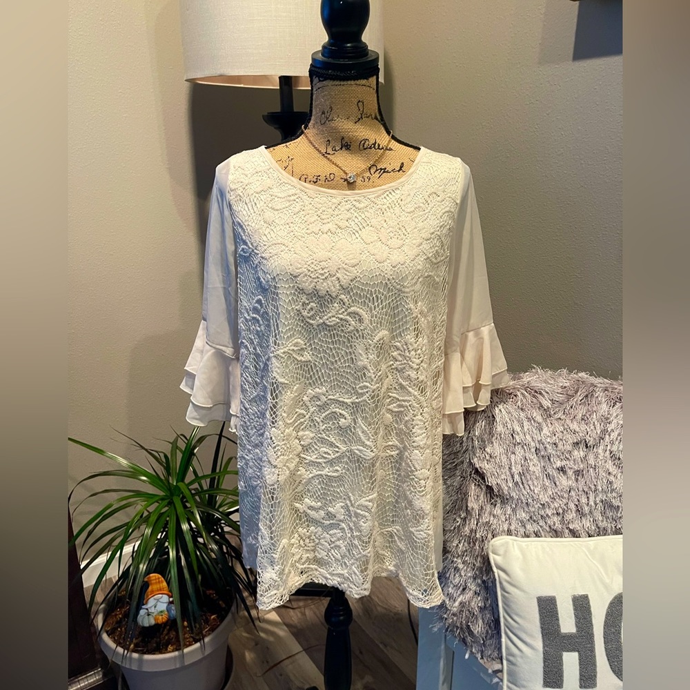 Beautiful cream colored ruffle sleeved, embroidered top! New without tags!